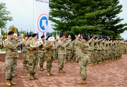 a band plays at a change of command ceremony