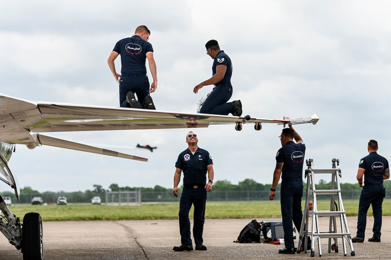 Airmen work on an aircraft.