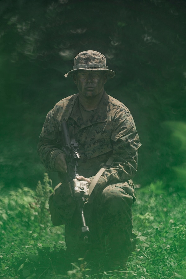 U.S. Marine Corps Cpl. James Grass, an anti-tank missileman with Weapons Company, Third Battalion, 23rd Marine Regiment, poses for a photo while training for a squad competition at Fort Knox, Kentucky, on June 26, 2021. The goal of this training is to enable a rifle squad to complete any mission by perfecting skills like land navigation, patrolling, offensive and defensive postures, and mastery of weapons and tactics. (U.S. Marine Corps photo by Cpl. James Stanfield)