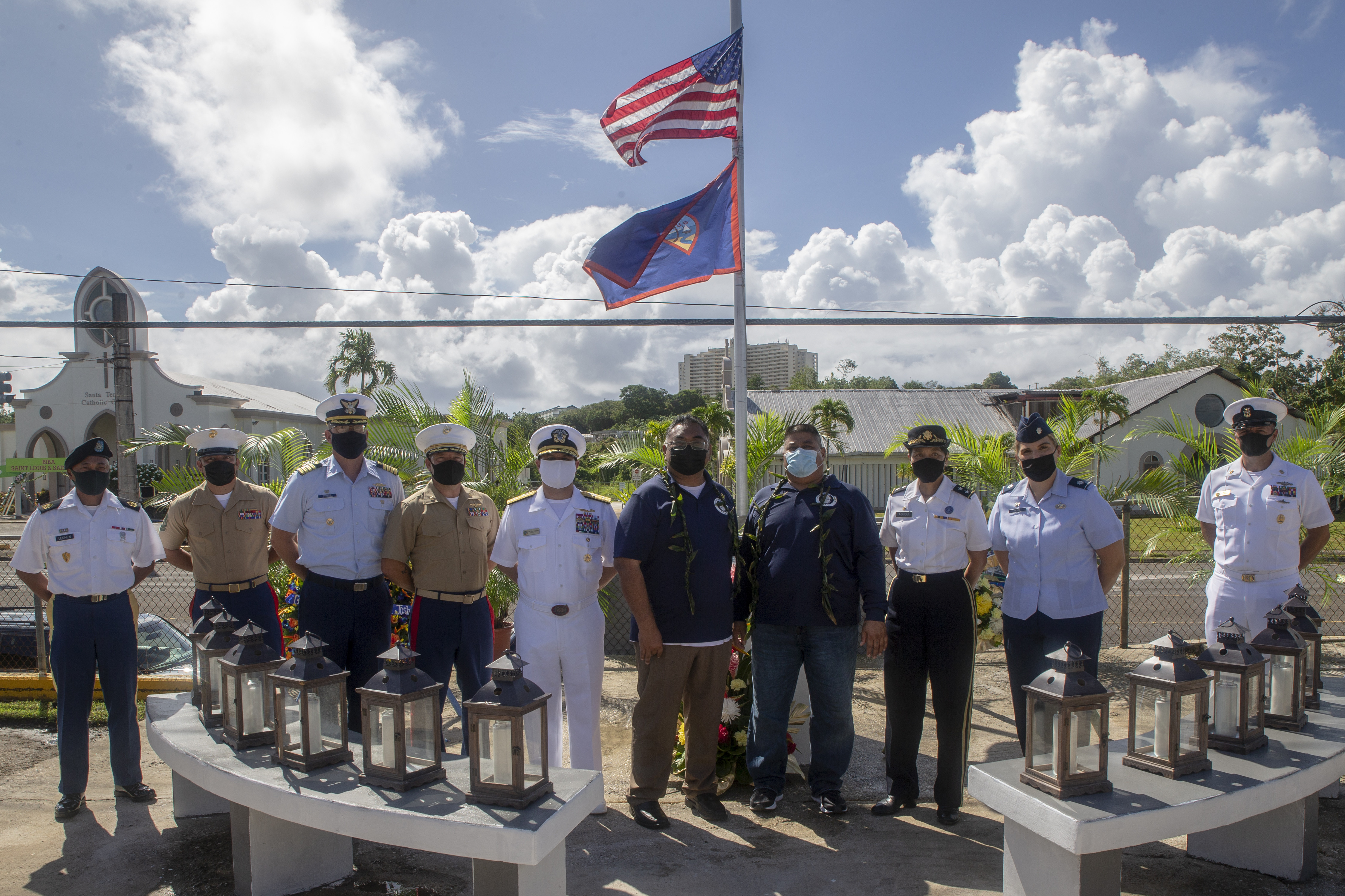 Marine Corps Base (MCB) Camp Blaz senior leaders pose for a photograph with other senior military leaders and the mayor and vice mayor of Mangilao, Guam during a wreath laying ceremony and memorial service at the Mangilao memorial, July 12, 2021.