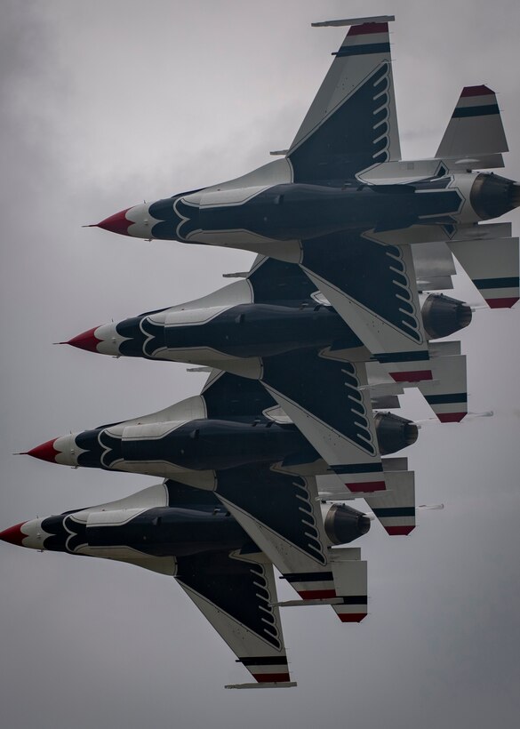 Aircraft fly in formation.