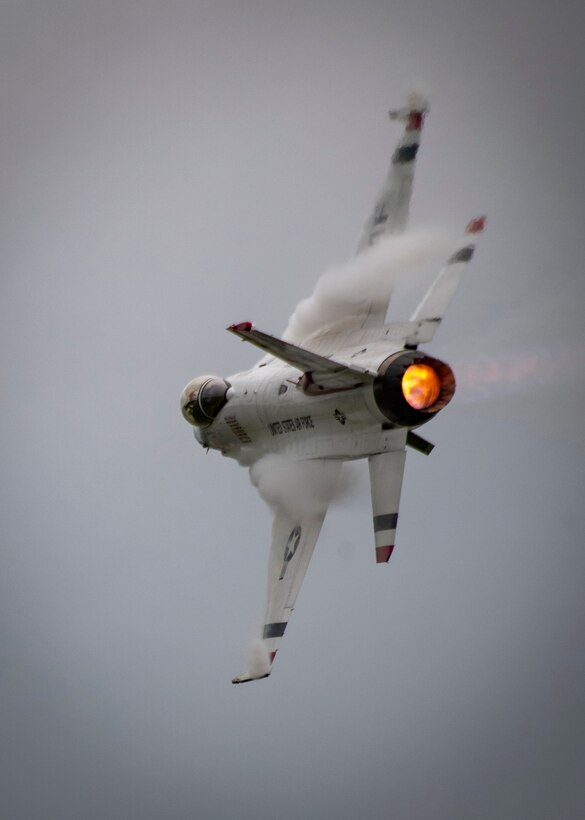 Aircraft fly in formation.