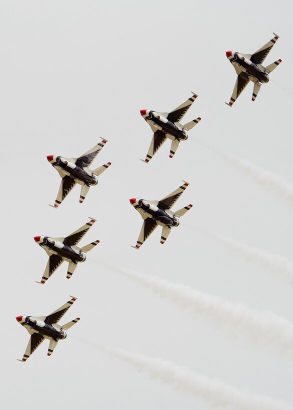 Aircraft fly in formation.