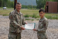 Maj. Gen. Torrence Saxe, commissioner for the Department of Military and Veterans Affairs and adjutant general of the Alaska National Guard, presents the National Guard Drug Demand Reduction Outreach Program of the Year for 2020 certificate to Master Sgt. Jennifer Theulen, Alaska National Counter Drug program coordinator, July 1, 2021.The Alaska National Guard Counter Drug Program was selected as the National Guard Drug Demand Reduction Outreach Program of the Year for 2020. The Counter Drug Program supports the Alaska National Guard efforts and initiatives to prevent drug abuse/misuse through prevention, education, outreach, and to detect and deter DoD military and civilian personnel from using illicit drugs or misusing prescription drugs.