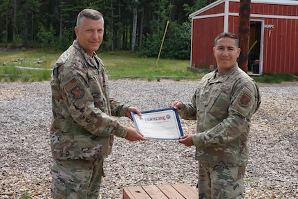 Maj. Gen. Torrence Saxe, commissioner for the Department of Military and Veterans Affairs and adjutant general of the Alaska National Guard, presents the National Guard Drug Demand Reduction Outreach Program of the Year for 2020 certificate to Tech. Sgt. Elljah Gutierrez, Alaska National Counter Drug program coordinator, July 1, 2021.The Alaska National Guard Counter Drug Program was selected as the National Guard Drug Demand Reduction Outreach Program of the Year for 2020. The Counter Drug Program supports the Alaska National Guard efforts and initiatives to prevent drug abuse/misuse through prevention, education, outreach, and to detect and deter DoD military and civilian personnel from using illicit drugs or misusing prescription drugs
