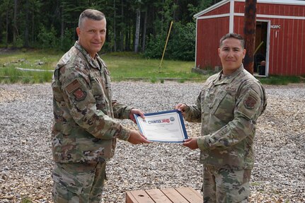 Maj. Gen. Torrence Saxe, commissioner for the Department of Military and Veterans Affairs and adjutant general of the Alaska National Guard, presents the National Guard Drug Demand Reduction Outreach Program of the Year for 2020 certificate to Tech. Sgt. Elljah Gutierrez, Alaska National Counter Drug program coordinator, July 1, 2021.The Alaska National Guard Counter Drug Program was selected as the National Guard Drug Demand Reduction Outreach Program of the Year for 2020. The Counter Drug Program supports the Alaska National Guard efforts and initiatives to prevent drug abuse/misuse through prevention, education, outreach, and to detect and deter DoD military and civilian personnel from using illicit drugs or misusing prescription drugs