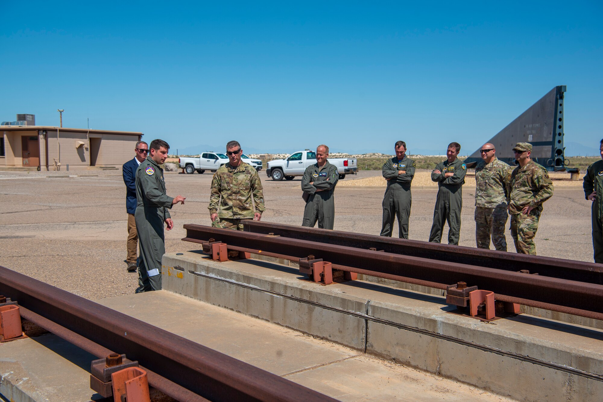 U.S. Army Brig. Gen. Eric Little, White Sands Missile Range commander, visits the 704th Test Group test track sled park, July 9, 2021, on Holloman Air Force Base, New Mexico. Little visited Holloman AFB to familiarize with local operations and tour partner units. (U.S. Air Force photo by Airman 1st Class Jessica Sanchez)