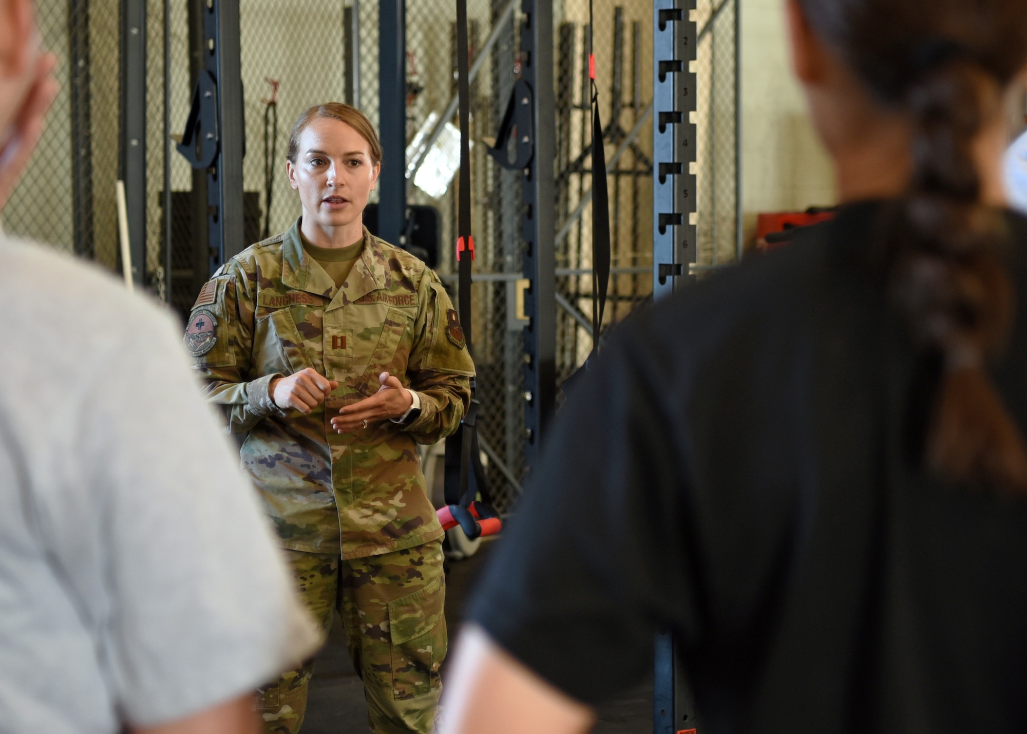 U.S. Air Force Capt. Danielle Langness, 17th Medical Group physical therapist, briefs the 312th Training Squadron students, on Goodfellow Air Force Base, Texas, June 30, 2021. Langness coordinated with the fire academy and created a Human Performance Team to mitigate the number of students being medically removed or set back during their technical training. (U.S. Air Force photo by Senior Airman Abbey Rieves)
