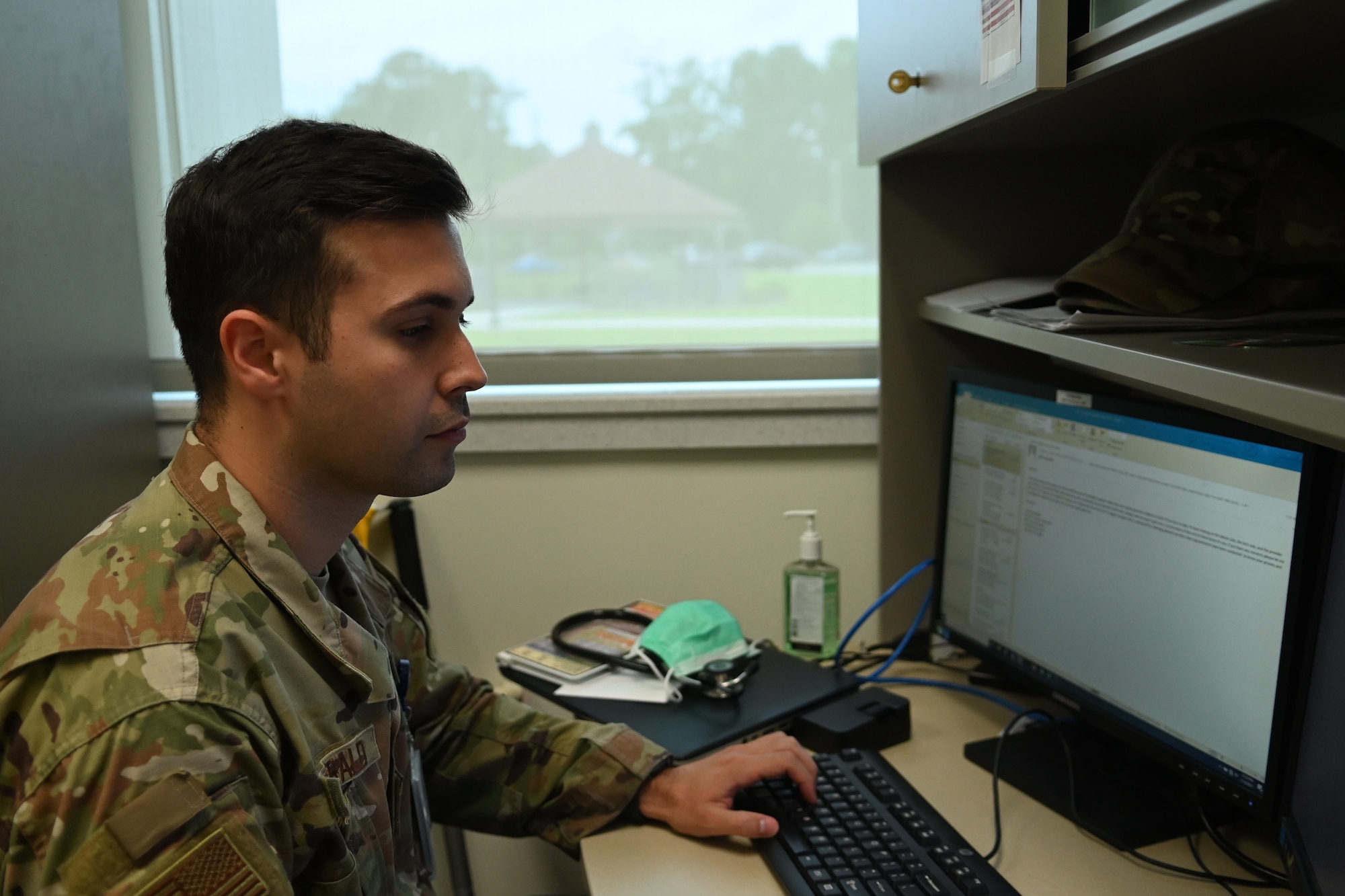 Staff Sgt. Jon Paul Fitzgerald, 336th Fighter Squadron independent duty medical technician, works on a computer at Seymour Johnson Air Force Base, North Carolina, July 13, 2021. IDMT’s are able to diagnose and treat active duty members within their established protocols. (U.S. Air Force Photo by Airman 1st Class David Lynn)