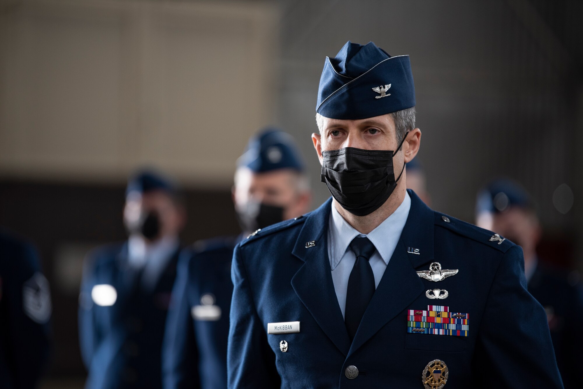 U.S. Air Force Col. William McKibban, 52nd Fighter Wing vice commander, stands at parade rest in front of a formation for the 52nd FW Change of Command ceremony July 15, 2021, on Spangdahlem Air Base, Germany. The mission of the 52nd Fighter Wing is to deliver airpower options to deter and combat aggression. (U.S. Air Force photo by Staff Sgt. Melody W. Howley)
