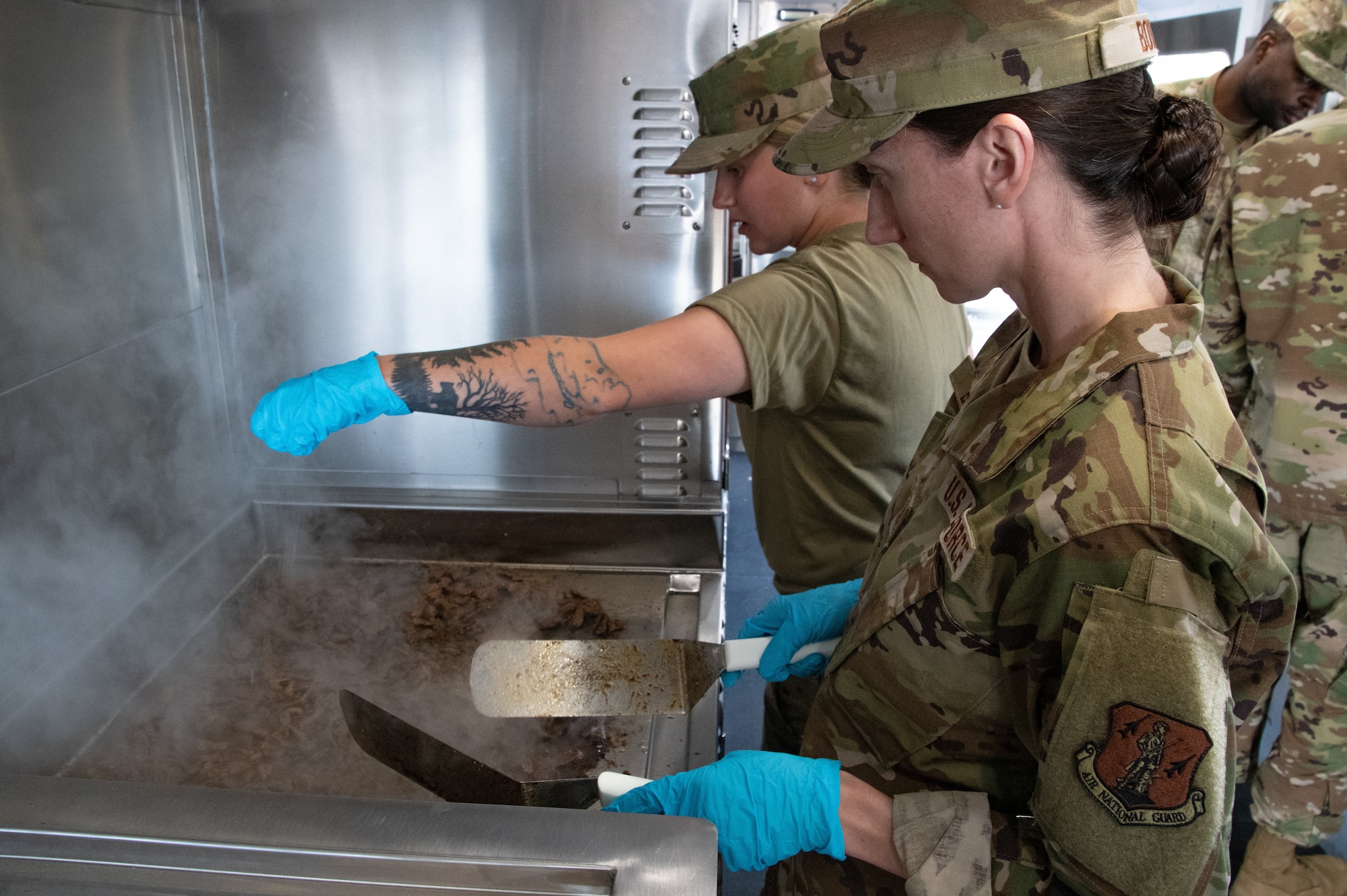 A Disaster Relief Mobile Kitchen Trailer was delivered to the 168th Wing KC-135 Stratotanker flying unit and the 168th Force Support Squadron, Services Sustainment Flight, are training and preparing on the emergency response asset in the event of an emergency disaster in the arctic and pacific regions.  The Airmen of the 168th Wing Services recently refueled their fellow Guard members during a lunch as part of their training to become familiar with their domestic operations DMRKT asset to the mission.  The DMRKT is designed to support first responders during domestic operations and disaster emergency relief missions. The Services flight Airmen are able to provide food rapidly to those who are hungry, both the emergency crews and those affected. (U.S. Air National Guard photo by Senior Master Sgt. Julie Avey)