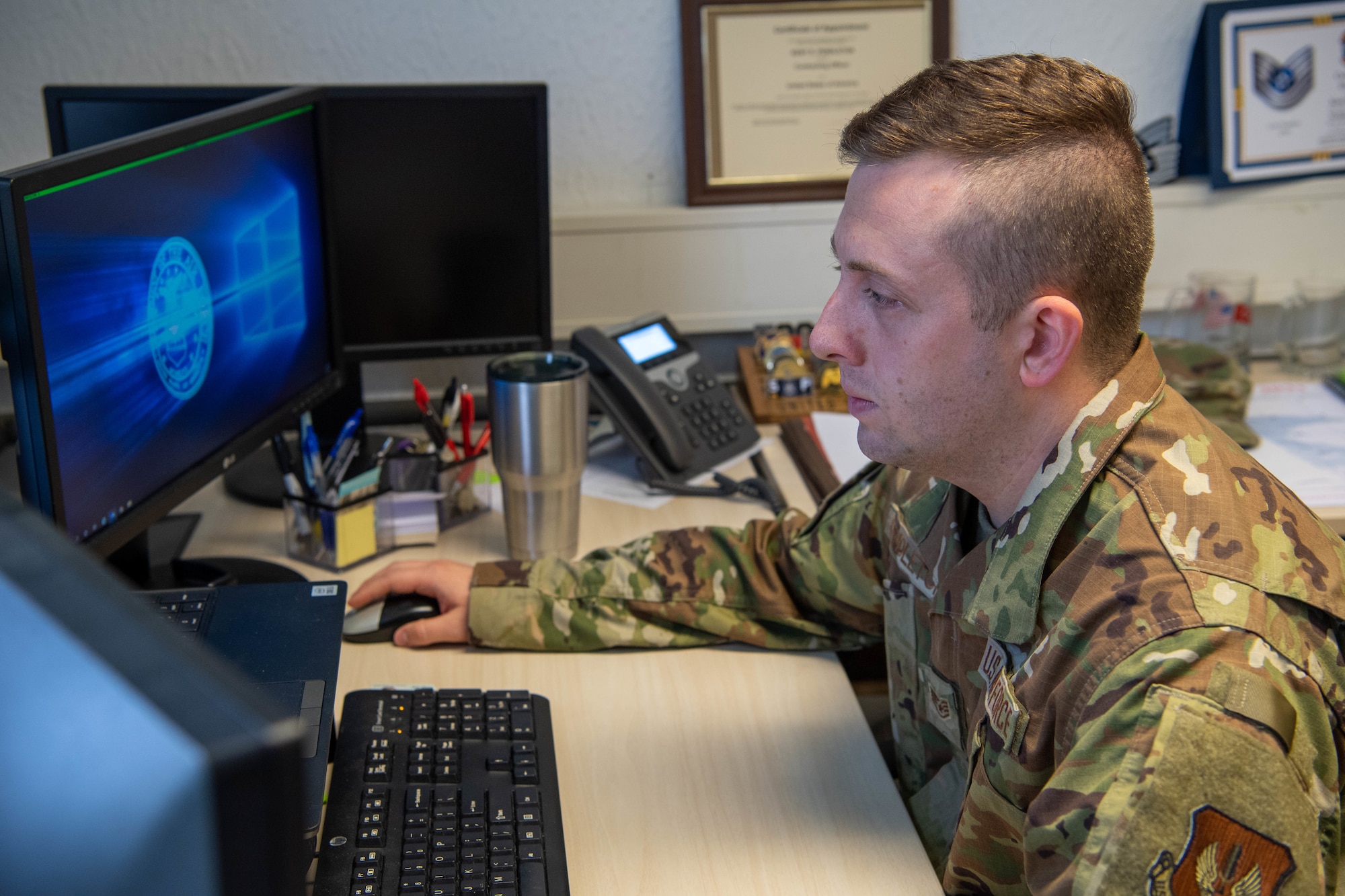 Airman looks at his computer