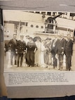 A photo of a Coast Guard personnel and civilians in 1923.