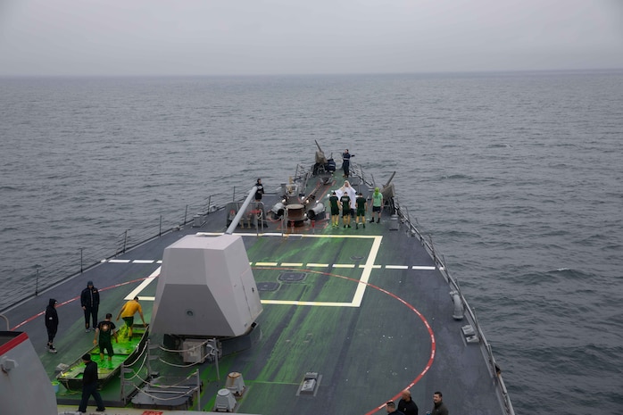 210708-N-CJ510-1278 NORWEGIAN SEA (July 8, 2021) Sailors aboard the Arleigh Burke-class guided-missile destroyer USS Roosevelt (DDG 80) participate in an “Order of the Blue Nose” ceremony, July 8, 2021. Roosevelt, forward-deployed to Rota, Spain, is on its second patrol in the U.S. Sixth Fleet area of operations in support of regional allies and partners and U.S. national security interests in Europe and Africa. (U.S. Navy photo by Mass Communication Specialist 2nd Class Andrea Rumple)