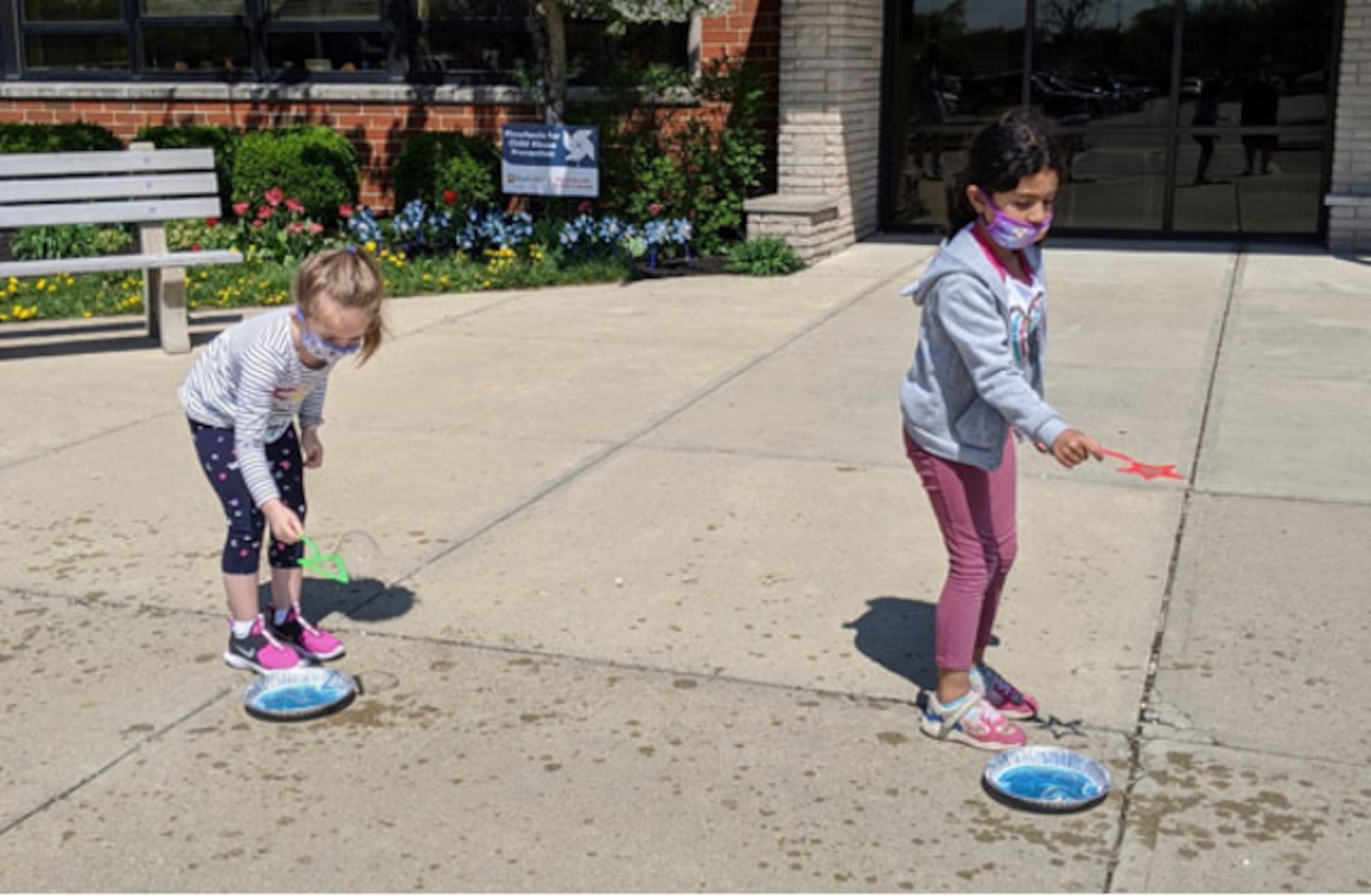 Students at Main Elementary School in Beavercreek take part in a “bubbles and water” experiment during the Wizards of Wright! program presentation in April.