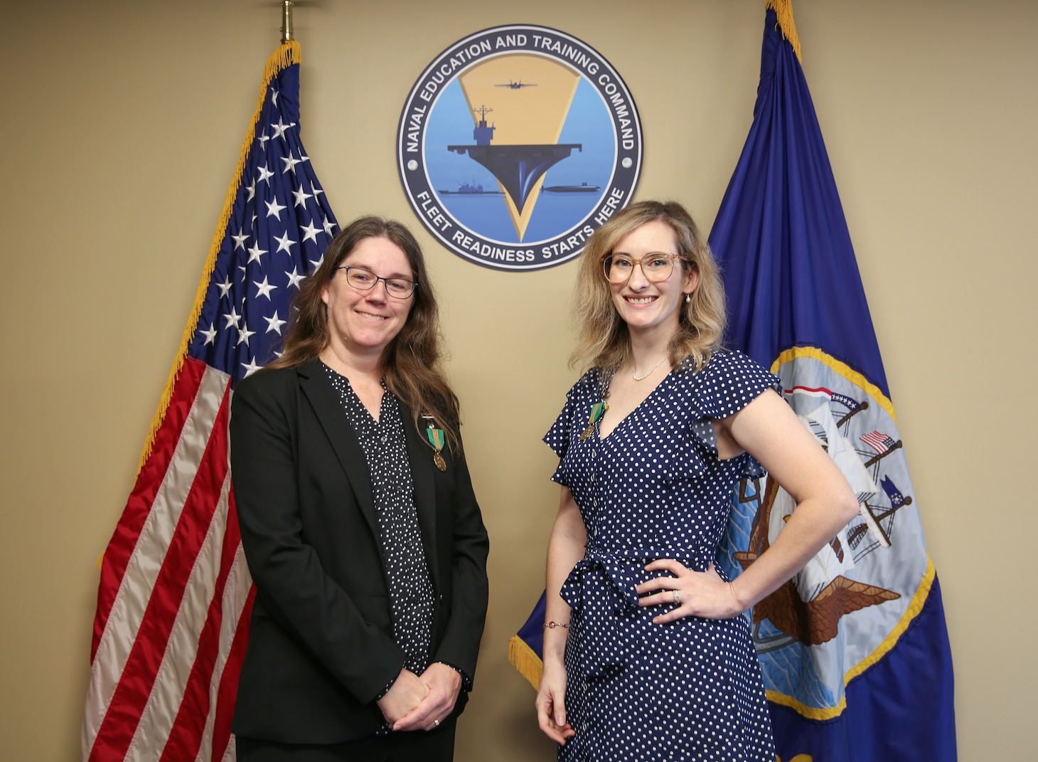 Carla McCarthy, left, deputy public affairs officer at Naval Education and Training Command's (NETC) Public Affairs Office in Pensacola, was selected as NETC’s second quarter of Fiscal Year 2021 Senior Civilian of the Quarter (COQ), and Brooke Passione, information system security officer (ISSM) and Navy qualified validator for NETC cyber security was selected as the Junior COQ.