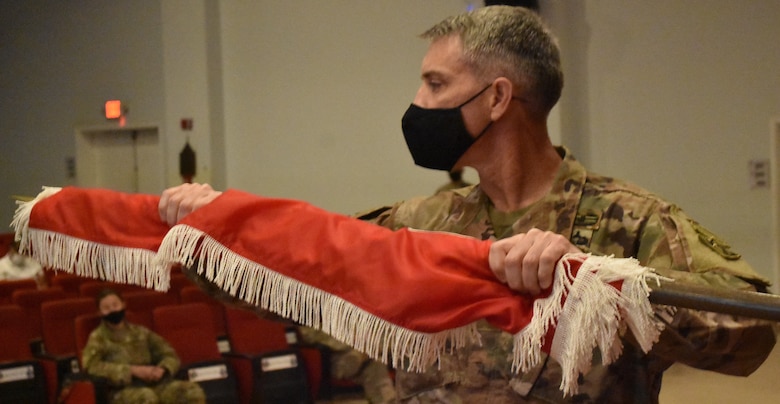 The Transatlantic Expeditionary District colors are in good hands with Colonel Mark Geraldi, inaugural commander taking charge during this historical ceremony to uncase the colors in Kuwait on Armed Forces Day, May 15, 2021. (Photo by Rick Benoit)