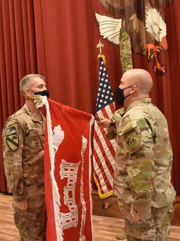 Mission accomplished- the colors of the Transatlantic Expeditionary District are uncased during an historic ceremony at Camp Arifjan, Kuwait on May 15, 2021. (Photo by Rick Benoit)