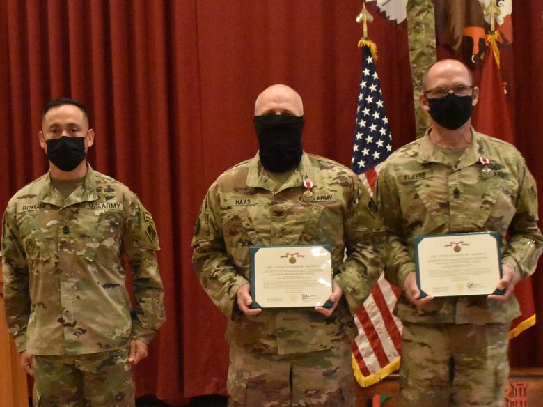 Transatlantic Division Command Sergeant Major Delfin Romani presented two prestigious awards, the Meritorious Service Medals to Task Force Essayons outgoing Commander, Colonel John Haas, Jr., and outgoing Senior Enlisted Advisor, Sergeant Major William Klaers during an awards ceremony May 15, 2021 at Camp Arifjan, Kuwait. (Photo by Rick Benoit)