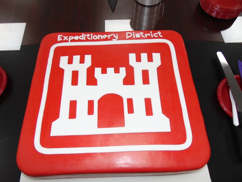 In celebration of the arrival of the new Expeditionary District Commander, a ceremonial cake was enjoyed by all within the District.