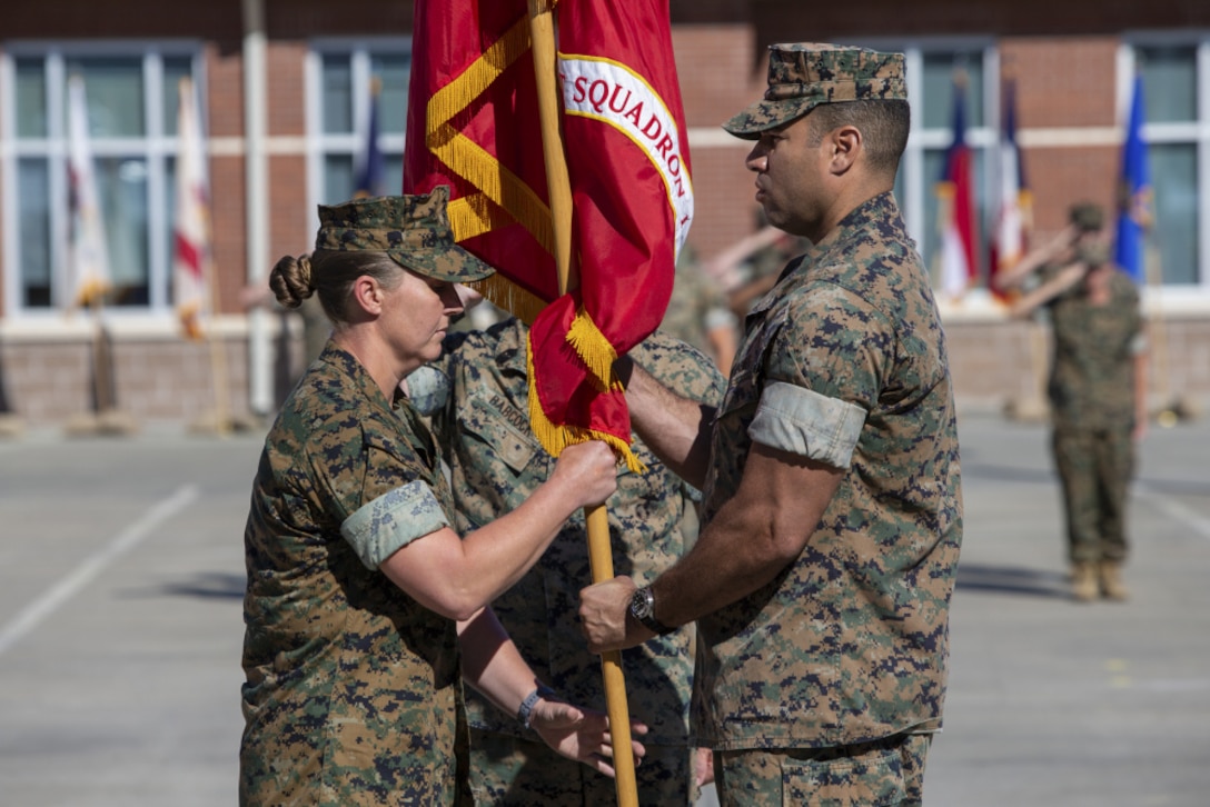 Col McCarthy reviews the citation prior to presenting LtCol Coates his award documentation.