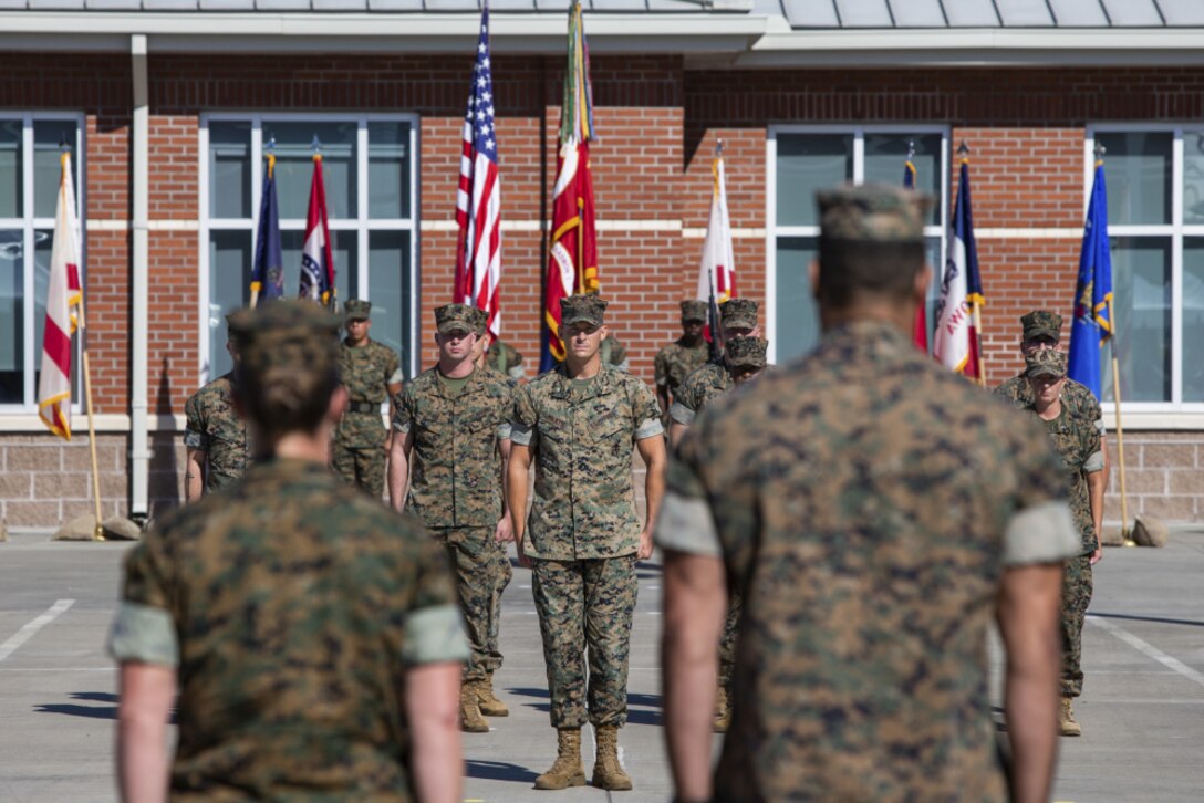 SgtMaj Timothy M. Babcock delivers the Squadron Colors to off-going Commander, LtCol Zachary A. Coates.