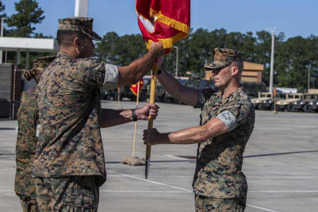 The Commander of Troops presents the Colors to MACG-28 Commanding Officer, Col Michael C. McCarthy.