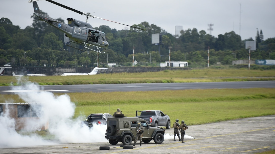 U.S. Navy Adm. Craig S. Faller, commander of U.S. Southern Command, visits with Guatemalan military members.