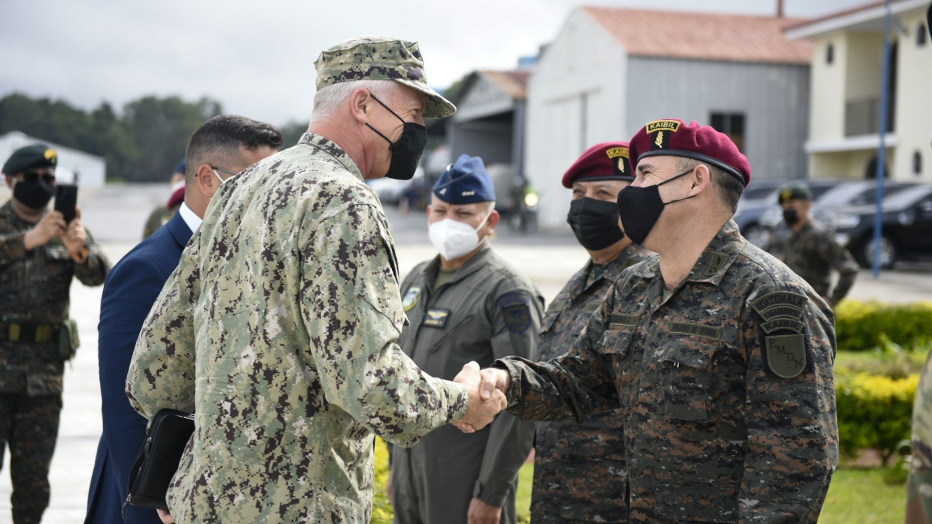 U.S. Navy Adm. Craig S. Faller, commander of U.S. Southern Command, visits with Guatemalan military members.