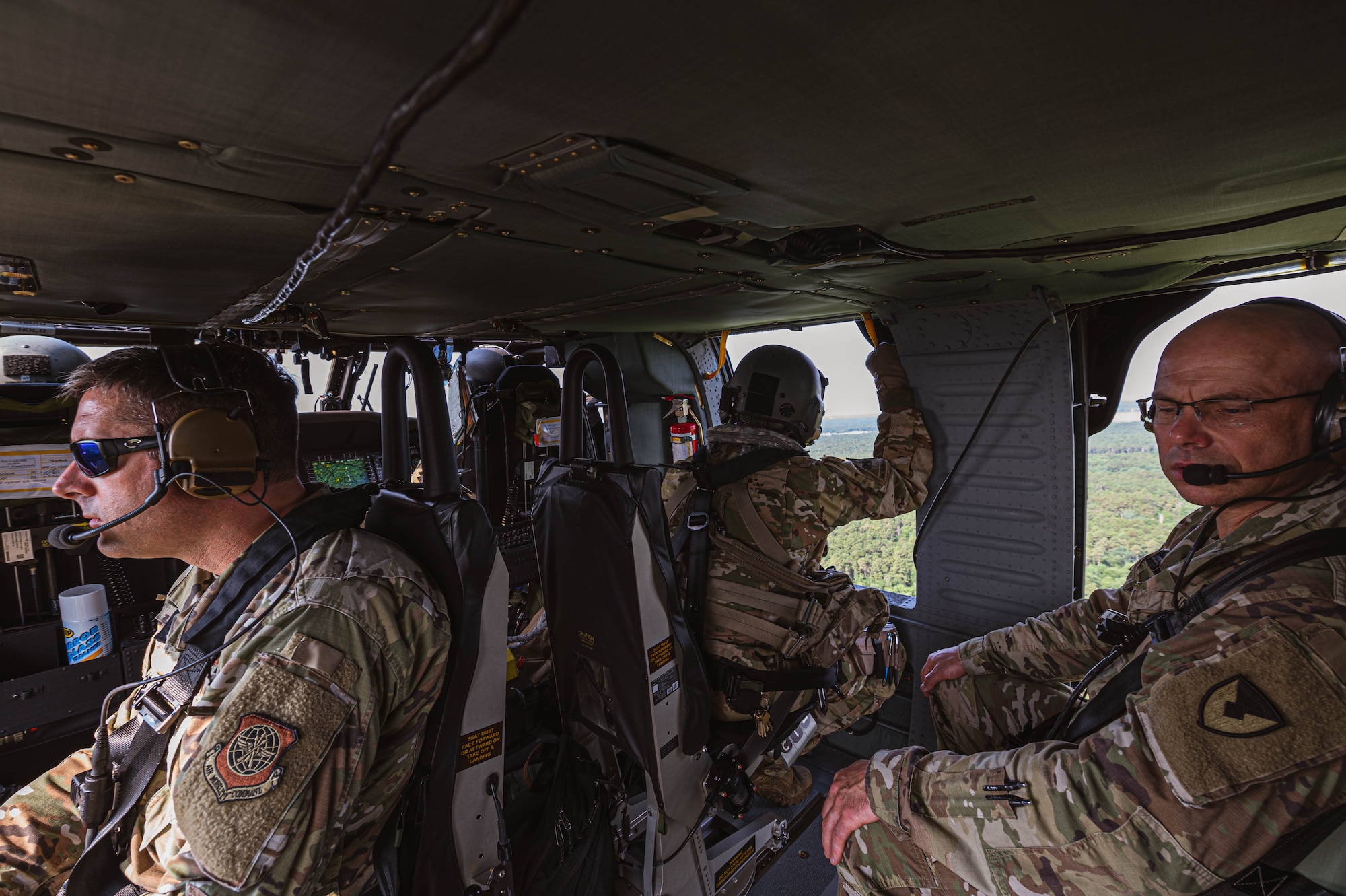 U.S. Air Force Col. Wes Adams, Joint Base McGuire-Dix-Lakehurst commander and 87th Air Base Wing commander, and U.S. Army Col. Jon A. Brierton, Army Support Activity, Dix, commander, overlook New Jersey aboard a UH-60 Blackhawk
