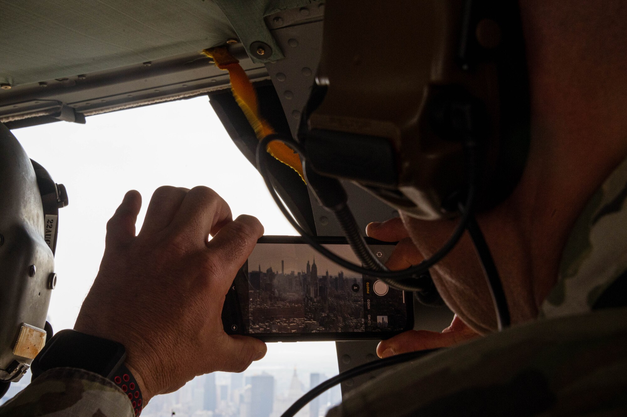 U.S. Army Col. Jon A. Brierton, Army Support Activity, Dix, commander, takes a photo of New York City, NY