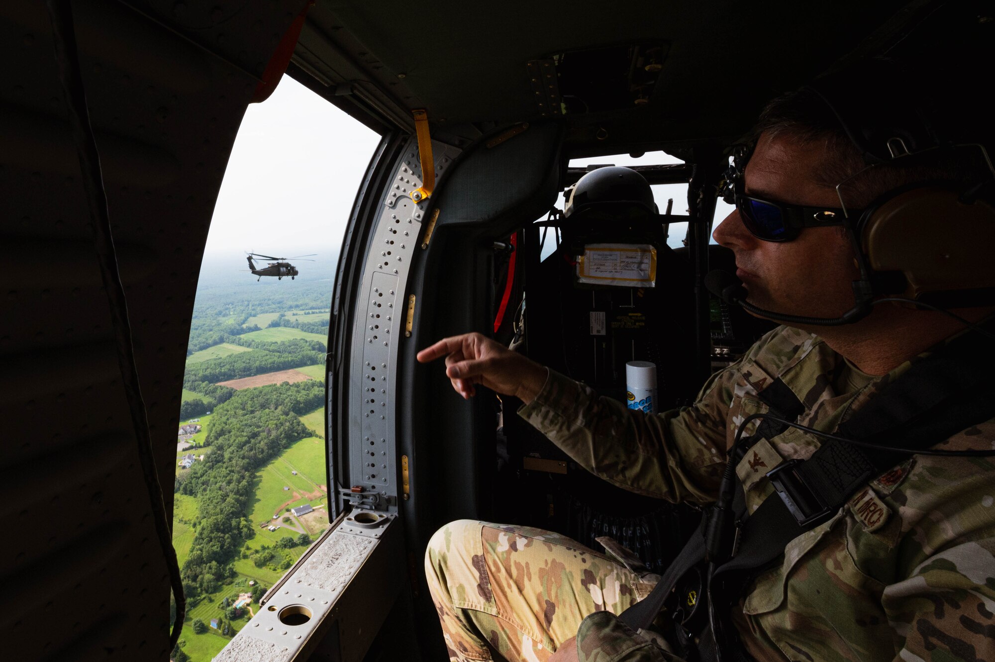 U.S. Air Force Col. Wes Adams, Joint Base McGuire-Dix-Lakehurst commander and 87th Air Base Wing commander, overlooks New Jersey aboard a UH-60 Blackhawk