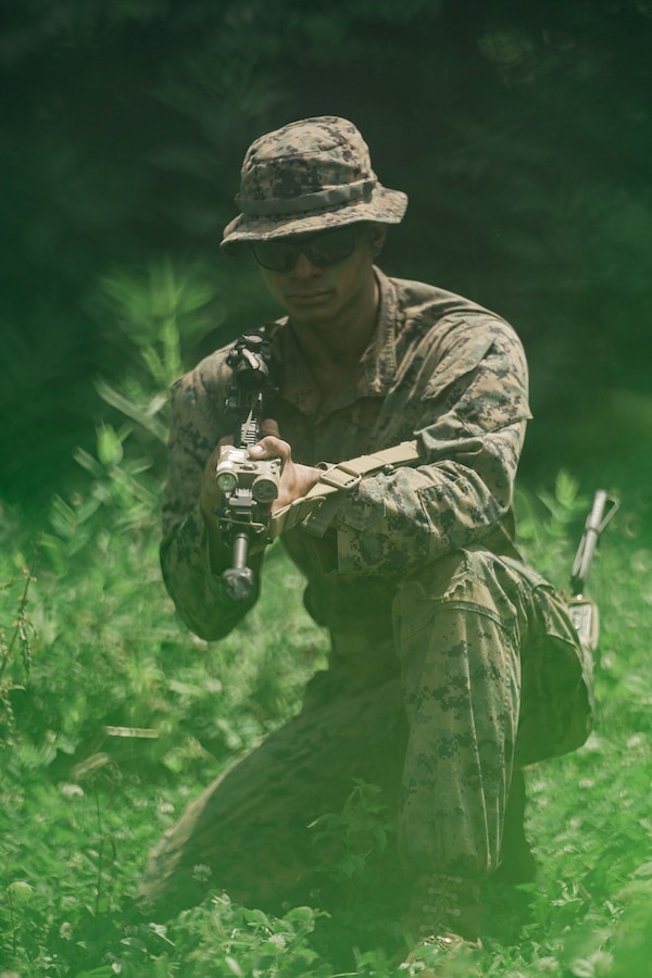U.S. Marine Corps Cpl. Adam Nall, a rifleman with Kilo Company, Third Battalion, 23rd Marine Regiment, poses for a photo while training for a squad competition at Fort Knox, Kentucky, on June 26, 2021. The goal of this training is to enable a rifle squad to complete any mission by perfecting skills like land navigation, patrolling, offensive and defensive postures, and mastery of weapons and tactics. (U.S. Marine Corps photo by Cpl. James Stanfield)