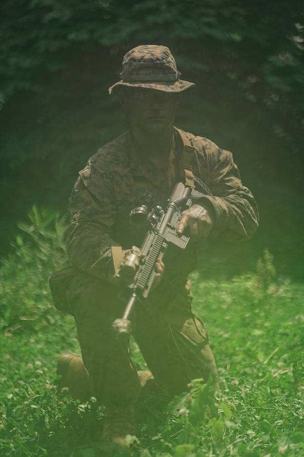 U.S. Marine Corps Cpl. Zachary Thrift, a machine gunner with Lima Company, Third Battalion, 23rd Marine Regiment, poses for a photo while training for a squad competition at Fort Knox, Kentucky, on June 26, 2021. The goal of this training is to enable a rifle squad to complete any mission by perfecting skills like land navigation, patrolling, offensive and defensive postures, and mastery of weapons and tactics. (U.S. Marine Corps photo by Cpl. James Stanfield)