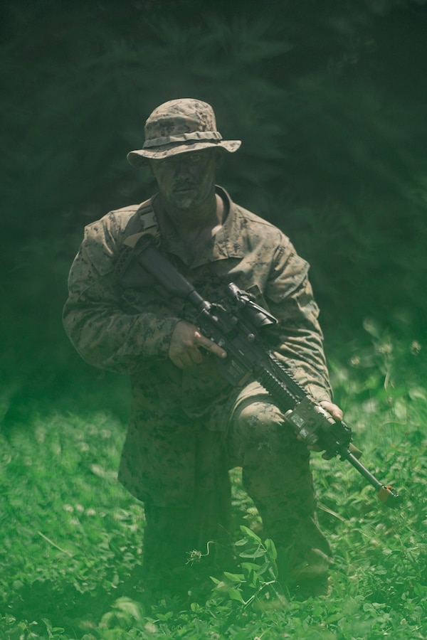 U.S. Marine Corps LCpl. Alec Ruble, a rifleman with India Company, Third Battalion, 23rd Marine Regiment, poses for a photo while training for a squad competition at Fort Knox, Kentucky, on June 26, 2021. The goal of this training is to enable a rifle squad to complete any mission by perfecting skills like land navigation, patrolling, offensive and defensive postures, and mastery of weapons and tactics. (U.S. Marine Corps photo by Cpl. James Stanfield)