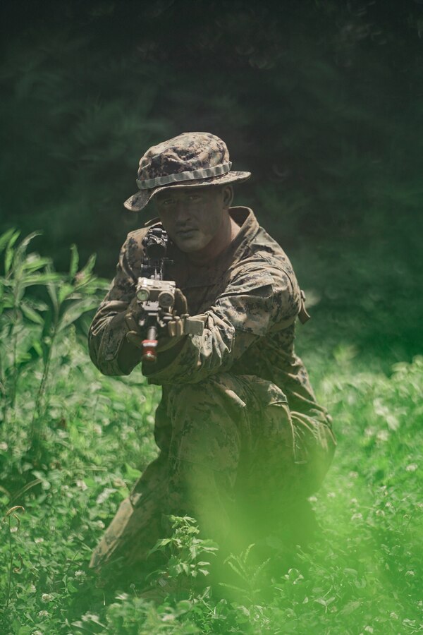 U.S. Marine Corps LCpl. Dawson Jennings, a rifleman with India Company, Third Battalion, 23rd Marine Regiment, poses for a photo while training for a squad competition at Fort Knox, Kentucky, on June 26, 2021. The goal of this training is to enable a rifle squad to complete any mission by perfecting skills like land navigation, patrolling, offensive and defensive postures, and mastery of weapons and tactics. (U.S. Marine Corps photo by Cpl. James Stanfield)
