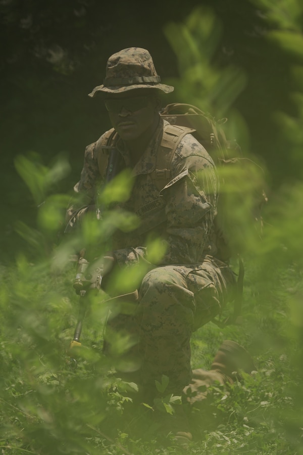 U.S. Marine Corps Sgt. Jodeci Parker, a rifleman with Weapons Company, Third Battalion, 23rd Marine Regiment, poses for a photo while training for a squad competition at Fort Knox, Kentucky, on June 26, 2021. The goal of this training is to enable a rifle squad to complete any mission by perfecting skills like land navigation, patrolling, offensive and defensive postures, and mastery of weapons and tactics. (U.S. Marine Corps photo by Cpl. James Stanfield)