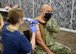 Air Force nurse administers COVID-19 vaccine