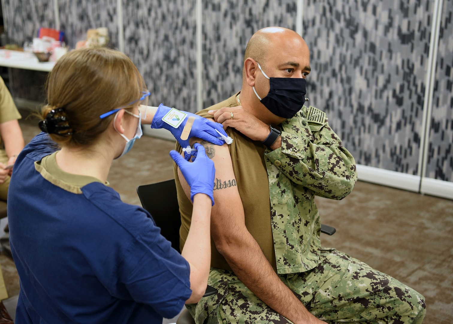 Air Force nurse administers COVID-19 vaccine