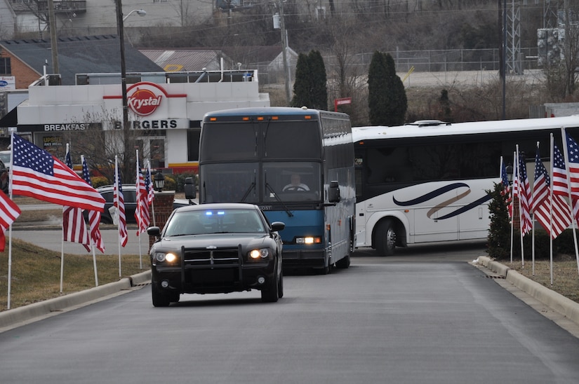 Family and friends of the 2123rd Transportation Company cheer for their Soldier as they arrive for the welcome home ceremony in Richmond, Ky., Feb. 4 after their tour in Afghanistan.