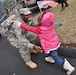 Spc. DaRun Poe, 2123rd Transportation Company truck driver, gives his little daughter, Arianna, a big hug after coming back from his deployment in Afghanistan at the welcome home ceremony in Richmond, Ky., Feb. 4