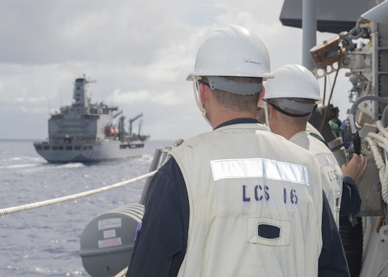 PHILIPPINE SEA (July 11, 2021) Sailors assigned to the Independence-variant littoral combat ship USS Tulsa (LCS 16) conduct an underway replenishment with the fleet replenishment oiler USNS Tippecanoe (T-AO 199) while underway in the Philippine Sea, July 11. Tulsa, part of Destroyer Squadron Seven, is on a rotational deployment, operating in the U.S. 7th Fleet area of operations to enhance interoperability with partners and serve as a ready-response force in support of a free and open Indo-Pacific region. (U.S. Navy photo by Mass Communication Specialist 3rd Class Chase Stephens)