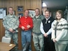 Capt. Bryan Combs, State Family Program director, Chief Warrant Officer 5 William Wason deputy director of Family Programs and Cindy Culver, State Youth coordinator, give the Kentucky Minuteman glass award to Tom Underwood, Kentucky Association of Executive in Frankfort, Ky., Jan. 20