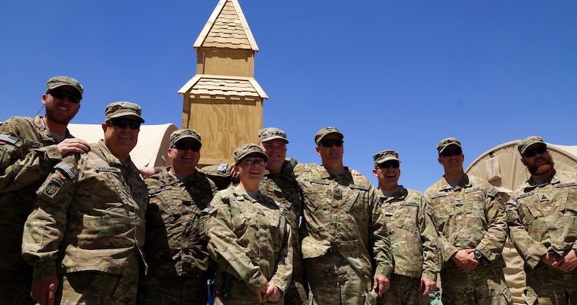 Sewell, a soldier from the Kentucky National Guard's Agribusiness Development Team 4 celebrated his re-dedication of faith through baptism following the day's worship service.