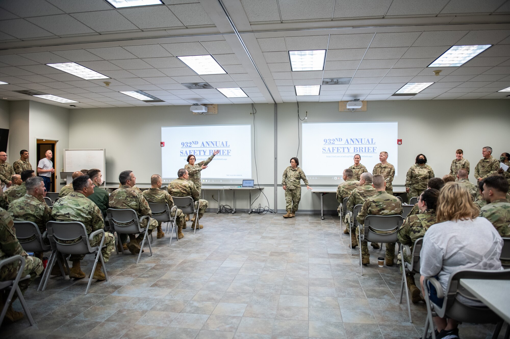 Lt. Col. Julie Novy, 932nd Airlift Wing, Inspector General Office, presents Senior Airman Warren McKeithen, 932nd AW, Medical Group, with an Inspector General coin at Scott Air Force Base, Illinois, July 10, 2021. During an active shooter drill McKeithen efficiently conducted a recall of the unit and realized there was a member who was non responsive. They simulated a death of a member and he was able to relay that one of his members was on base and was not found to the wing. McKeithen reacted to the situation properly unlike many units before him, earning him the IG coin! (U.S. Air Force Photo by Staff Sgt. Brooke Spenner)