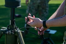 A photo of an airman handling wires