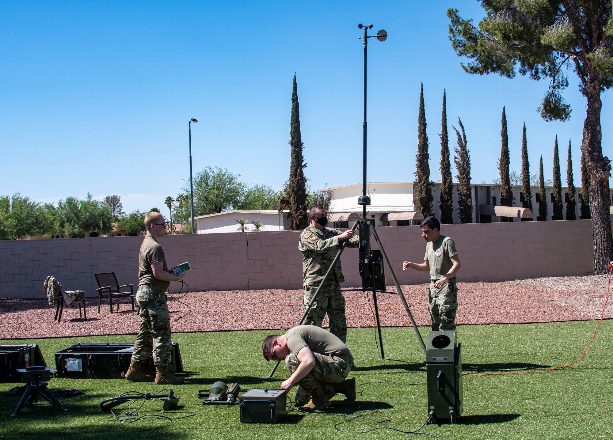 A photo of airmen setting up a weather station