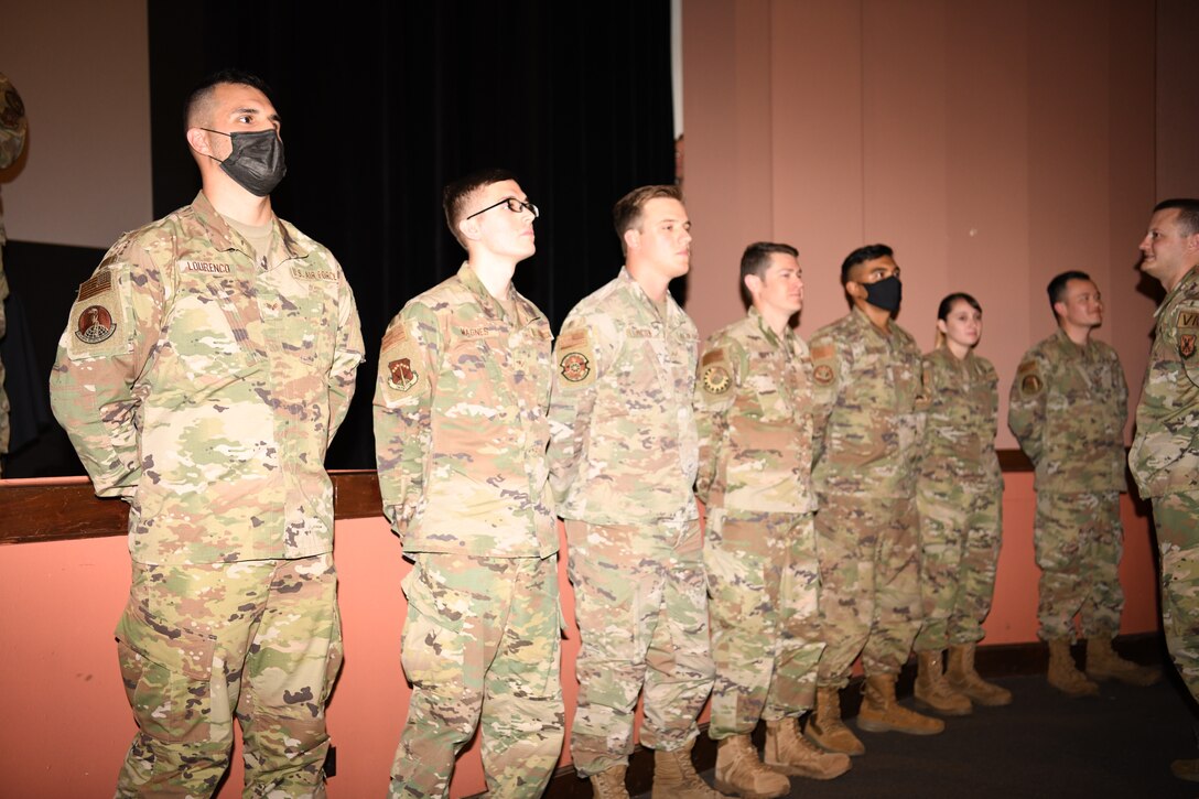 Members of the Raptor flight of ALS Class 21-F stand for recognition during their class graduation July 15, 2021, in the base theater on F. E. Warren Air Force Base, Wyo. ALS is a six-week course designed to prepare Airmen to assume supervisory duties as well as instruction in the practice of leadership and followership. Enlisted Airmen must graduate before supervising other Airmen. (U. S. Air Force photo by Airman 1st Class Charles Munoz)
