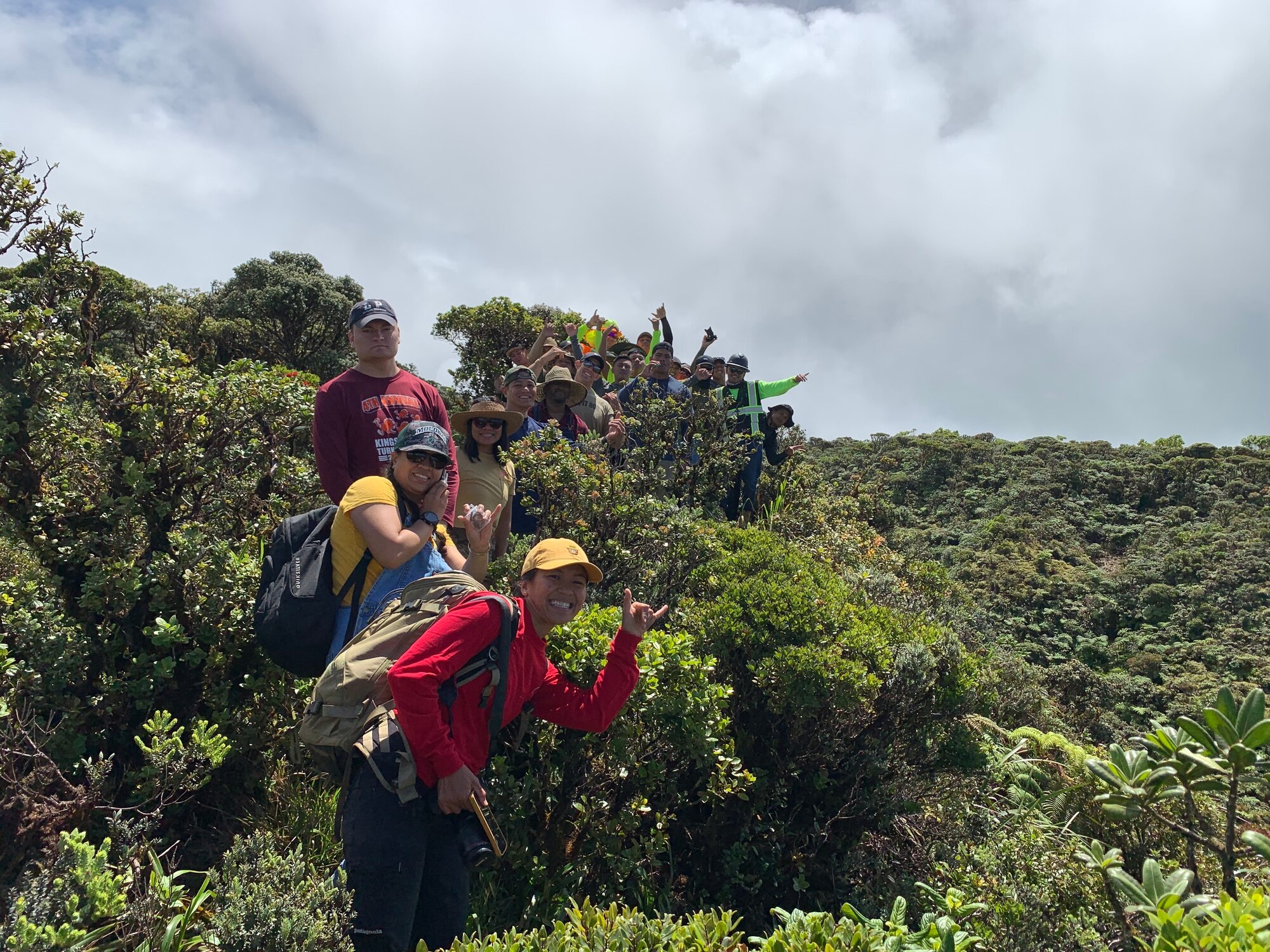 Airman 1st Class Genesaret Balladares,154th Security Forces Squadron member, leads a team of volunteers during a conservation event June 8, 2021, on Mount Kaala, Hawaii