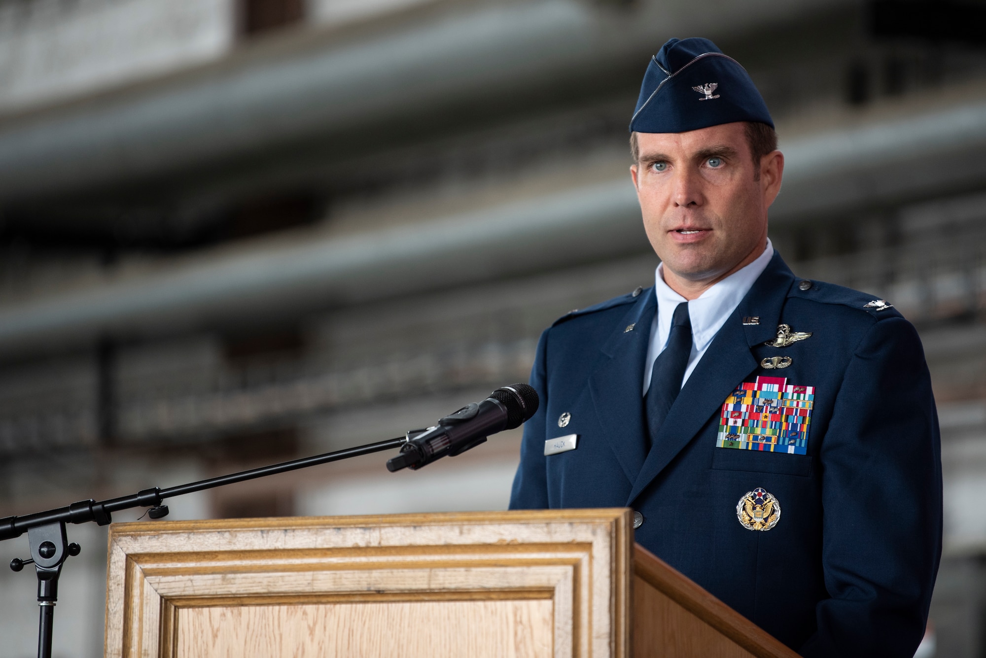 U.S. Air Force Col. Leslie Hauck, 52nd Fighter Wing incoming commander, gives his first remarks during the 52nd FW Change of Command ceremony July 15, 2021, on Spangdahlem Air Base, Germany. The 52nd FW supports the Supreme Allied Commander, Europe with mission-ready personnel and systems providing expeditionary air power for suppression of enemy air defenses, counter air, air interdiction, and close-air support. (U.S. Air Force photo by Staff Sgt. Melody W. Howley)